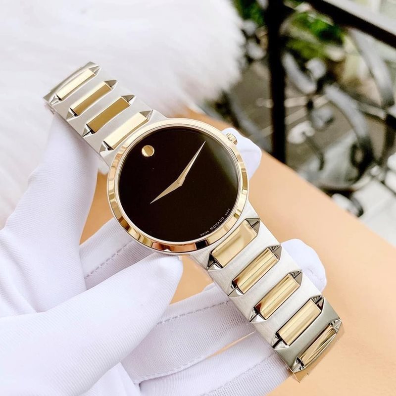 0607293 מובאדו שעון לגבר אלגנטי יוקרתי | דגם משולב זהב וכסף בלוח שחור נקי וקלאסי | שעונים שווצריים במבצע | מלאי מוגבל | שנתיים אחריות | Movado Temo Black Dial Two-Tone Men';s Watch 0607293