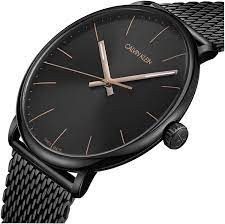 K8M21421 שעון קלווין קליין שחור אופנתי לגברים | דגם ברצועת רשת לוח שחור עם מחוגי זהב למראה יוקרתי | מלאי מוגבל | שנתיים אחריות | Calvin Klein Black PVD Mesh Bracelet Watch K8M21421