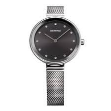 12034-009 שעון יד ברינג ברצועת רשת אופנתית | דגם קלאסי אלגנטי כולל 3 שנים אחריות | זכוכית ספיר שעוני ברינג בראשון לציון | BERING Women';s Stainless Steel Quartz Watch with Textile Strap 12034-009