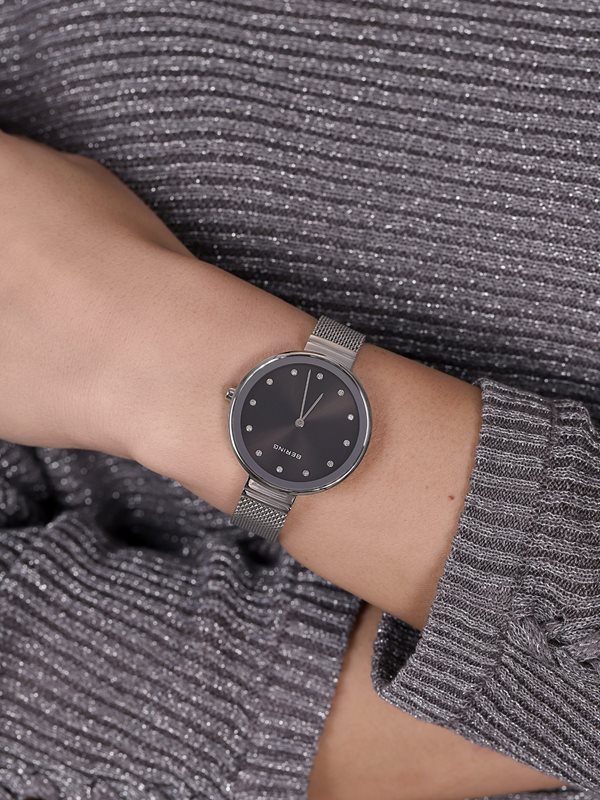 12034-009 שעון יד ברינג ברצועת רשת אופנתית | דגם קלאסי אלגנטי כולל 3 שנים אחריות | זכוכית ספיר שעוני ברינג בראשון לציון | BERING Women';s Stainless Steel Quartz Watch with Textile Strap 12034-009