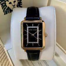 AK-3820GPBK שעון אן קליין מלבני במסגרת זהב | לוח ורצועה שחורים | שעון אלגנטי קלאסי לנשים | שנתיים אחריות | Anne Klein Glitter Accent WOMEN';S Watch AK-3820GPBK