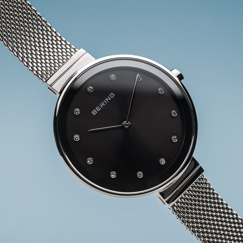 12034-009 שעון יד ברינג ברצועת רשת אופנתית | דגם קלאסי אלגנטי כולל 3 שנים אחריות | זכוכית ספיר שעוני ברינג בראשון לציון | BERING Women';s Stainless Steel Quartz Watch with Textile Strap 12034-009
