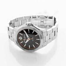 10412 שעון יוקרה של באום מרסייה לגברים | דגם בלוח שחור וכתום | מחוגים ואינדקס זוהרים בחושך | כולל שנתיים אחריות | מלאי מוגבל | Baume & Mercier Clifton Club Quartz Black Dial Stainless Steel 10412