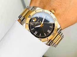 0607437 שעון מובאדו לגבר | דגם חדש של מותג היוקרה | רצועת השעון משולבת זהב וכסף |Movado 0607437 Mens Movado Sport Two tone Quartz