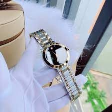 0607278 שעון מובאדו אלגנטי קלאסי לגבר | דגם משולב זהב לוח שחור נקי ומיוחד | שעון שווצרי יוקרתי דק | שנתיים אחריות | Movado Stiri Two-Tone Mens Watch 0607278