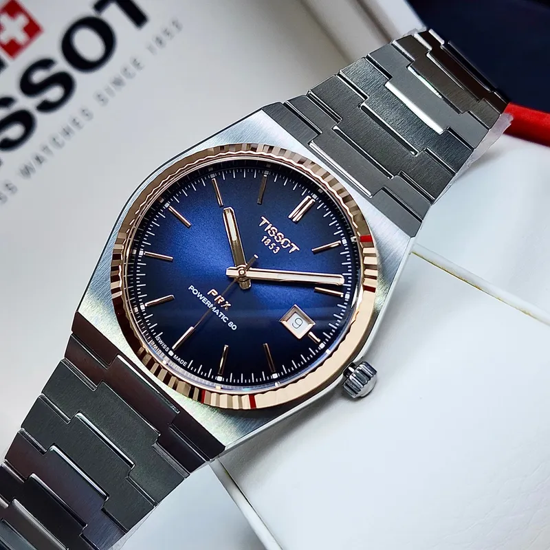 T931.407.41.041.00 שעון טיסו מיוחד לגברים | באזל זהב 18K בלוח כחול מיוחד | מנגנון אוטומטי 80 שעות | מלאי מוגבל | 3 שנים אחריות | Tissot PRX Powermatic 80 Steel & 18K Gold Bezel T9314074104100