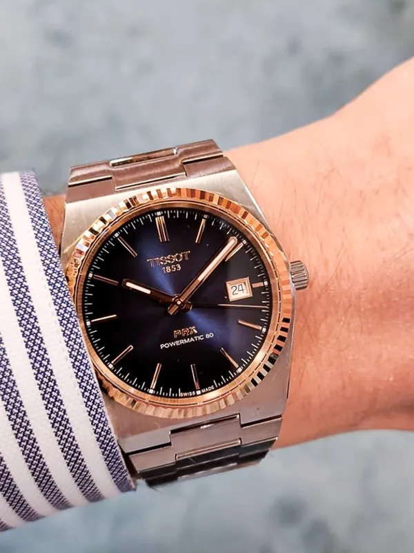 T931.407.41.041.00 שעון טיסו מיוחד לגברים | באזל זהב 18K בלוח כחול מיוחד | מנגנון אוטומטי 80 שעות | מלאי מוגבל | 3 שנים אחריות | Tissot PRX Powermatic 80 Steel & 18K Gold Bezel T9314074104100