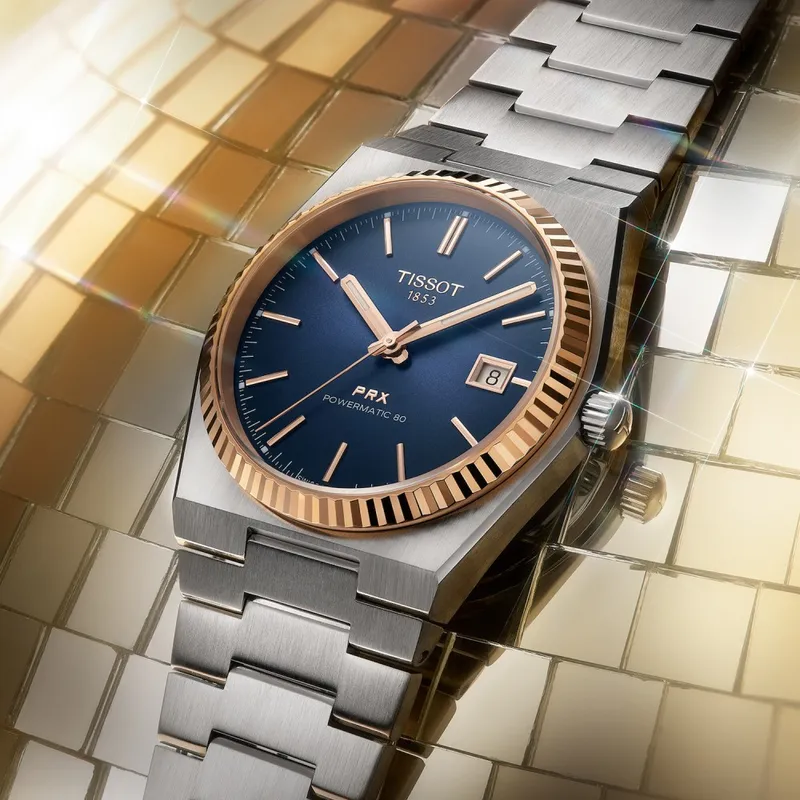 T931.407.41.041.00 שעון טיסו מיוחד לגברים | באזל זהב 18K בלוח כחול מיוחד | מנגנון אוטומטי 80 שעות | מלאי מוגבל | 3 שנים אחריות | Tissot PRX Powermatic 80 Steel & 18K Gold Bezel T9314074104100