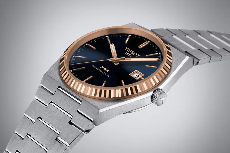 T931.407.41.041.00 שעון טיסו מיוחד לגברים | באזל זהב 18K בלוח כחול מיוחד | מנגנון אוטומטי 80 שעות | מלאי מוגבל | 3 שנים אחריות | Tissot PRX Powermatic 80 Steel & 18K Gold Bezel T9314074104100