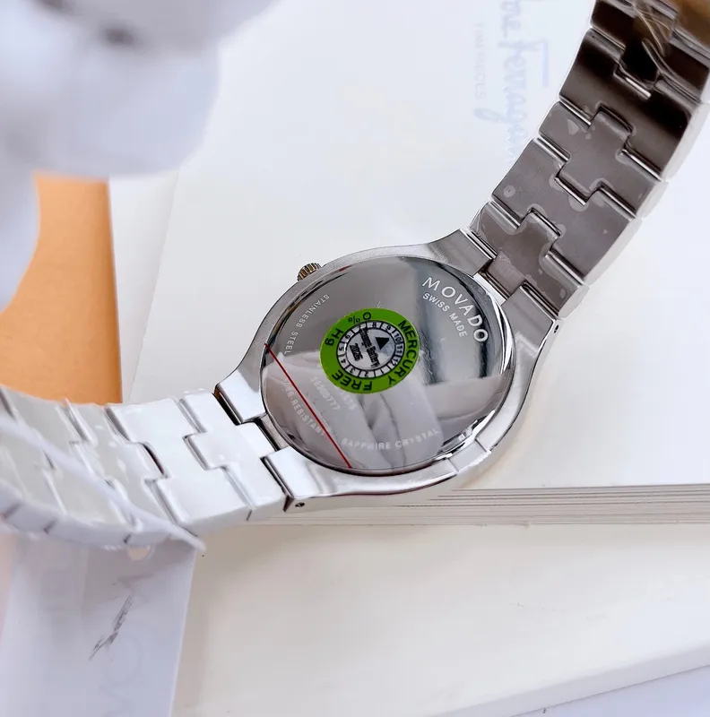 0607443 שעון מובאדו שוויץ יוקרתי לגברים | דגם אלגנטי בלוח | רצועה משולבת זהב | שנתיים אחריות | Movado 0607443 Juro Two-Toned with Black Dial Men';s