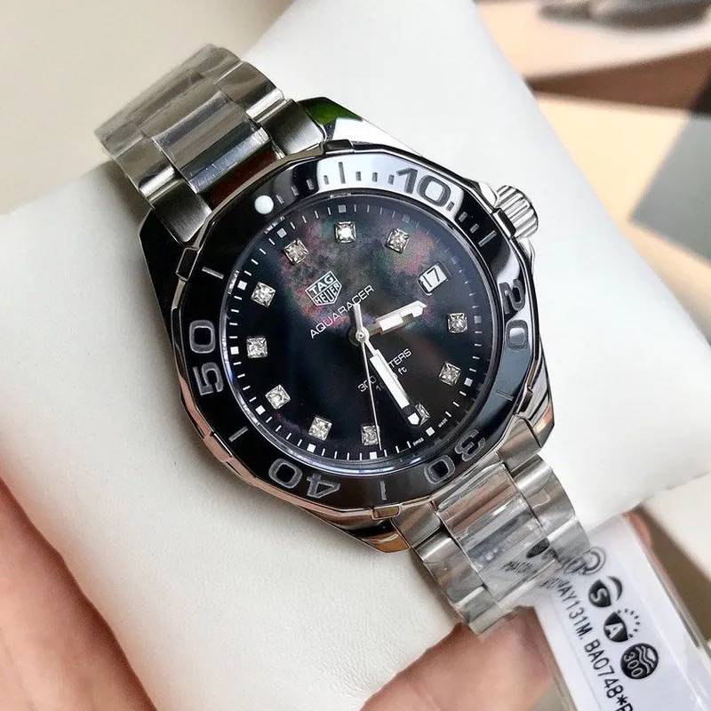 WAY131M.BA0748 שעון טאג הויאר לנשים משובץ 11 יהלומים לוח שחור פנינה | דגם 300 מטר מסדרת אקווה רייסר | שנתיים אחריות | TAG Heuer Aquaracer Lady Black/Steel ?35 mm,model WAY131M.BA0748