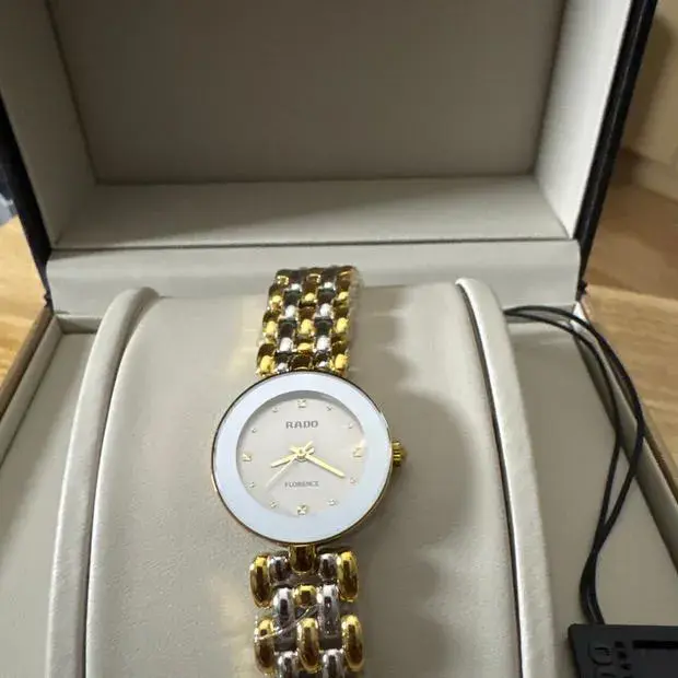 R-37452010 | R48745103 | שעון ראדו יבואן רשמי מסדרת פלורנס | דגם מיני 23 מ';';מ משולב זהב בלוח אפור | 5 שנים אחריות | מלאי מוגבל | Rado Florence Stainless Steel Twotone Grey Dial Ladies Watch R48745103