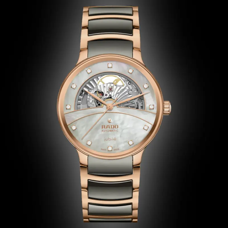 R-60283091 | R30028912 שעון ראדו יבואן רשמי לגברים מסדרת סנטריקס רוז גולד | דגם קרמיקה אוטומטי סקלטון | לוח פנינה משובץ 12 יהלומים | 5 שנים אחריות | Rado Centrix Automatic Diamonds Open Heart R3002891