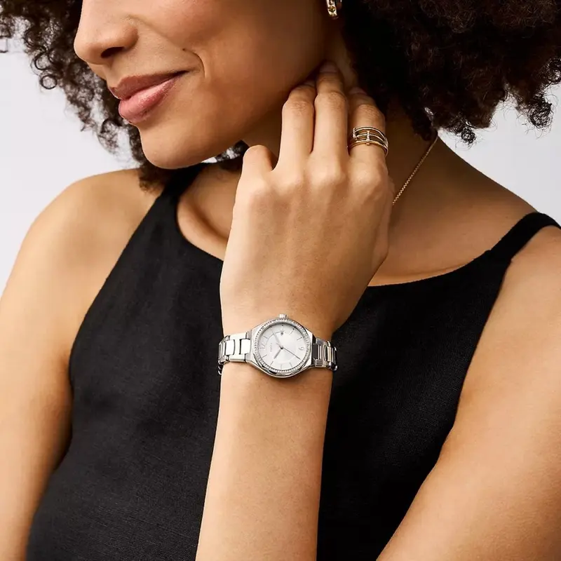 BQ3954 שעון פוסיל חדש לנשים | דגם כסוף בלוח לבן | משובץ זרקונים בבאזל | שעוני אופנה לאישה | שנתיים אחריות | Eevie Three-Hand Date Stainless Steel Watch - BQ3954