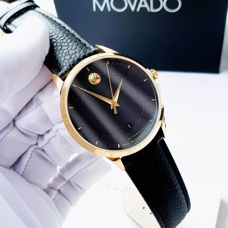 0606875 שעון יד מובאדו יבואן רשמי לגברים | דגם זהב אוטומטי ברצועת עור | לוח שחור מיוחד עם חלון אחרי שקוף | מלאי מוגבל | Automatic Black Dial Black Leather Men';s Watch 0606875 by Movado