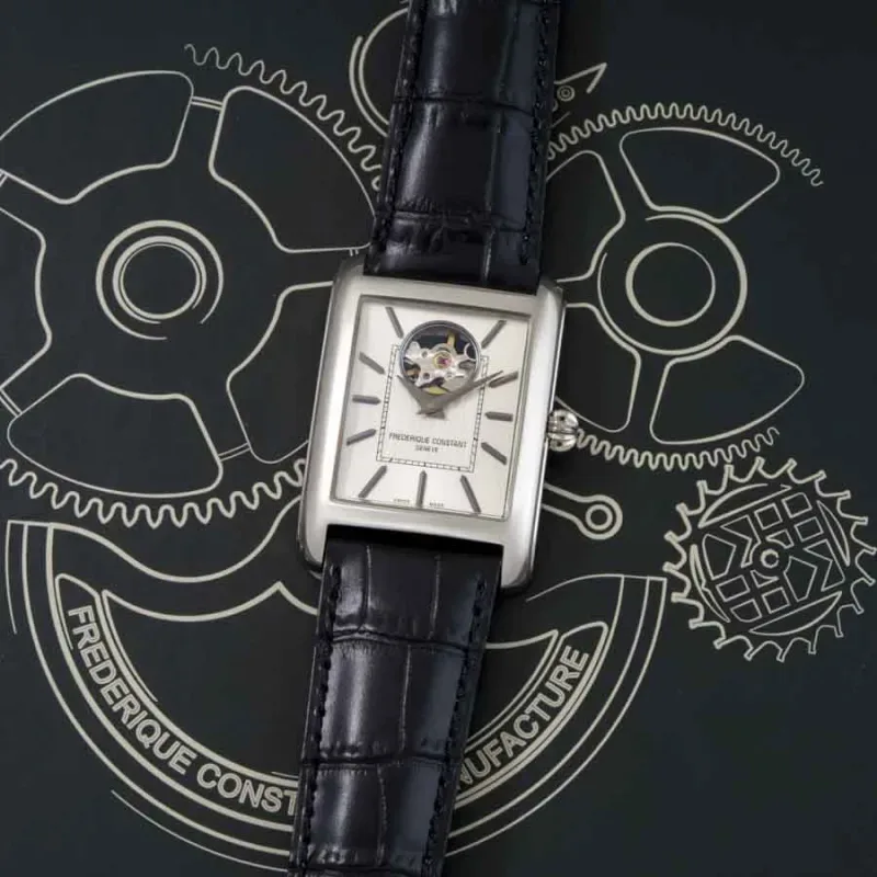 FC-311S4C6 שעון אלגנטי יוקרתי מלבני של פרדריק קונסטנט לגברים | לוח כסוף סאנריי עם לב פתוח | מנגנון אוטומטי גב שקוף | שנתיים אחריות יבואן רשמי | Carr?e Heart Beat Automatic FC-311S4C6